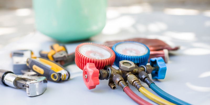 HVAC tools on table - Seasonal HVAC Maintenance Checklist: 10 Questions to Ask Your Technician